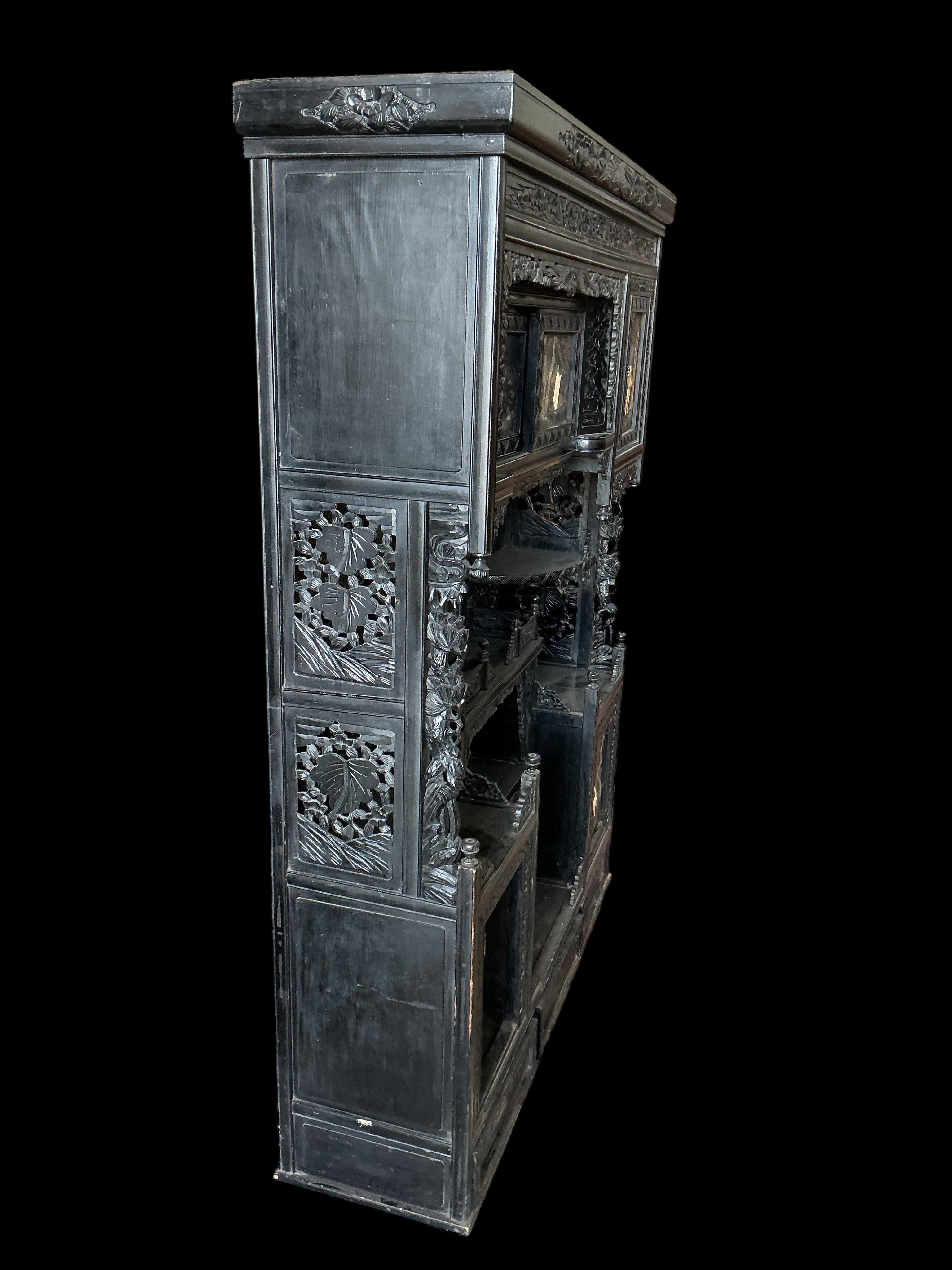 A Japanese Meiji period ebonised cabinet, width 110cm, depth 32cm, height 150cm CITES Submission reference Q4A31H9Q